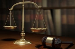 Scales of justice next to gavel